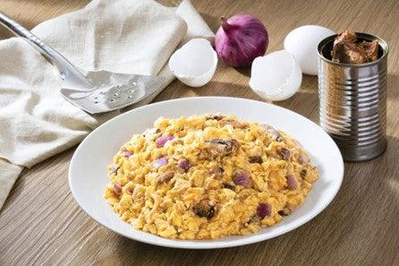 Scrambled eggs with sardines, red onion and toasted bread